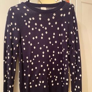 Navy blue pullover with white polka dots.